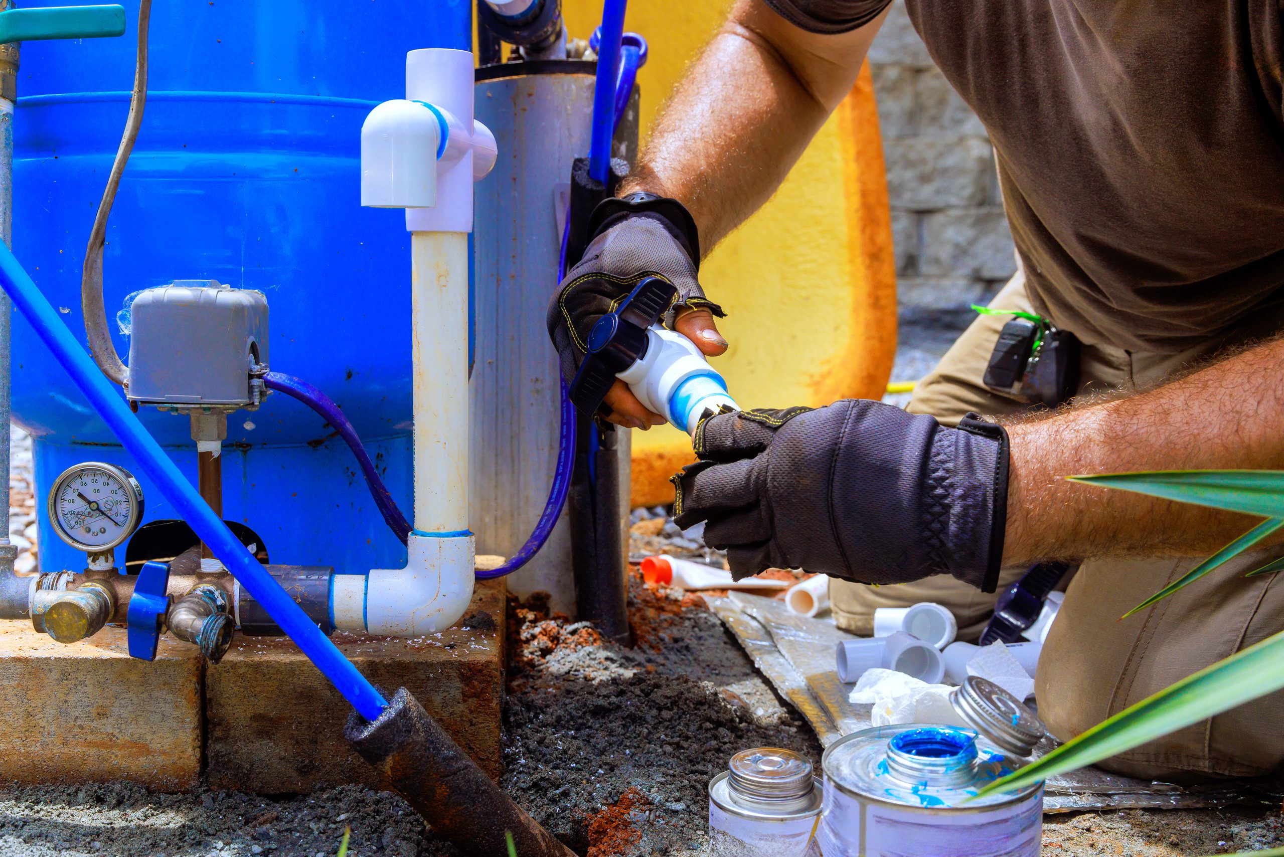 Plumber performing residential pipe repair